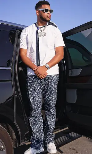 K-Trap wearing Louis Vuitton pants
