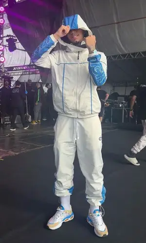 Veigh wearing High Company jacket