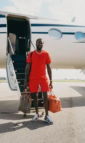 Meek Mill wearing Goyard bag