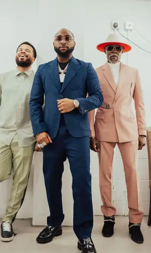 Davido wearing Gucci jacket
