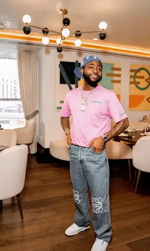 Davido’s Outfit in Loewe Jeans, Puma Sneakers & Chrome Hearts Cap (2023)