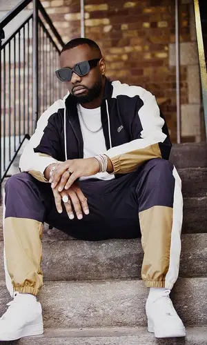 Gims wearing Lacoste pants