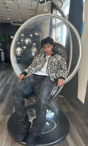Yung Fazo wearing Raf Simons jacket
