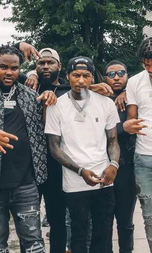 Tee Grizzley wearing Louis Vuitton shirt