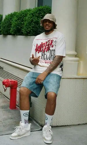 AJ Tracey’s Outfit in Hellstar T-Shirt & Louis Vuitton Shorts (2023)