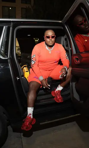 Saucy Santana’s Outfit in Chrome Hearts Sweatshirt, Balenciaga Eyewear & Matty Boy Socks (2023)