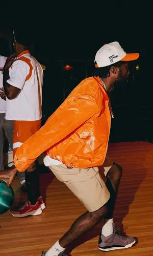 Meek Mill wearing Dior shorts