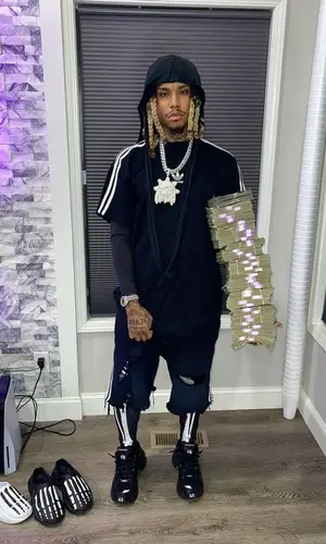 Lil Gnar wearing Adidas shorts