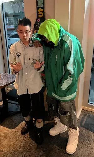 ASAP Bari’s Outfit in Martine Rose Jacket, Balenciaga Shorts & Louis Vuitton Boots (2023)