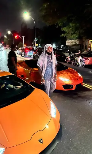 Money Man wearing Louis Vuitton shirt