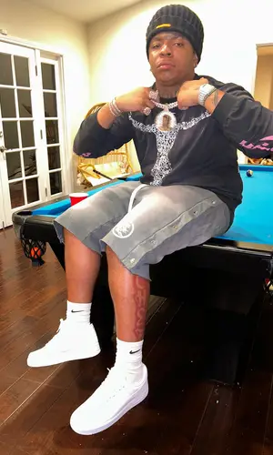 Lil Gotit’s Outfit in Hellstar T-Shirt, Heron Preston Hat & Nike Socks (2023)