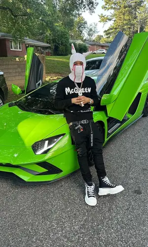 Lil Migo wearing Alexander McQueen sweater