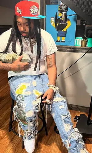 Icewear Vezzo wearing Mitchell & Ness cap