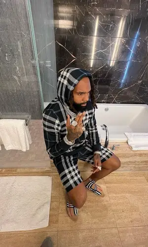 Money Man wearing Burberry shorts
