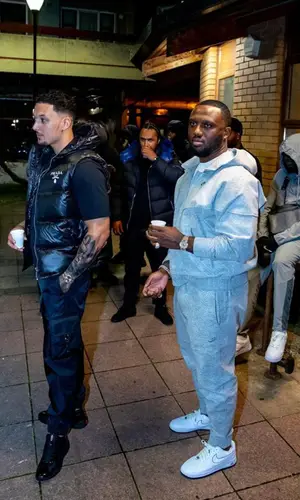 Slim wearing Prada pants
