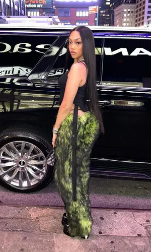 Jodie Woods wearing Versace boots