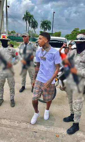 NLE Choppa wearing Burberry shorts