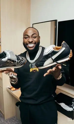 Davido wearing Puma sneakers