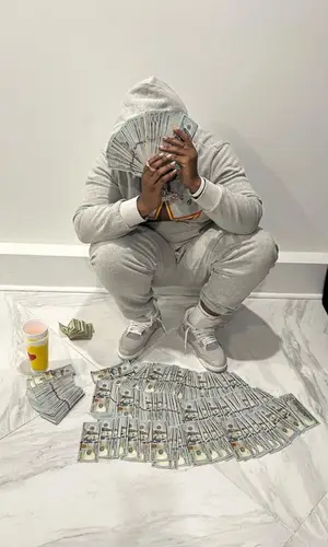 Big 30 wearing Denim Tears hoody