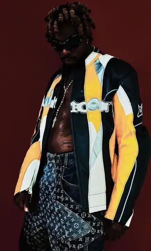 Asake wearing Balenciaga eyewear
