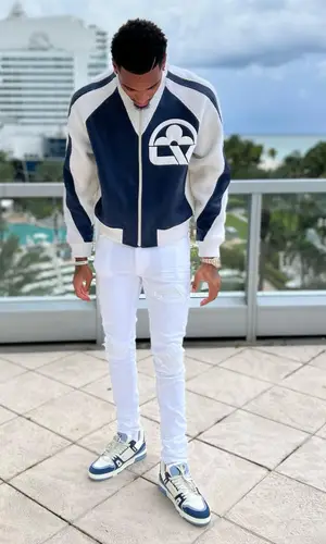Dejounte Murray wearing Louis Vuitton jacket