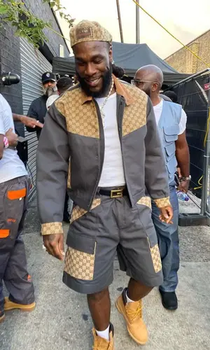 Burna Boy wearing Gucci jacket