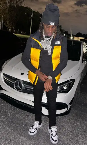 SleazyWorld Go wearing The North Face hat