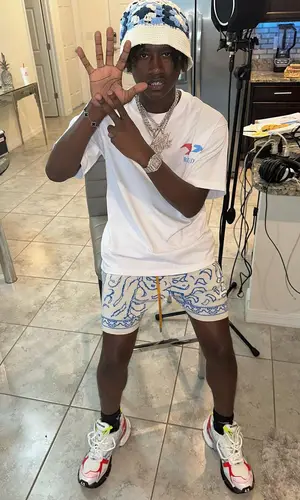 Baby Jungle’s Outfit in Rhude T-Shirt & Balenciaga Sneakers (2023)