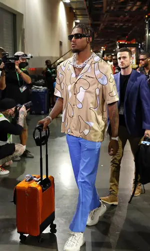 Tee Higgins wearing Prada eyewear