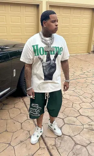 Finesse2tymes wearing Ricco Gioventu shorts