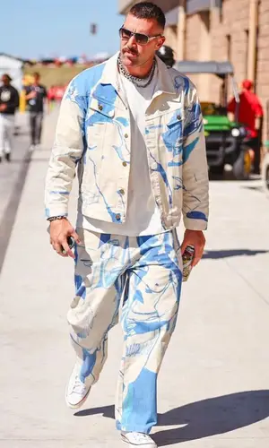 Travis Kelce wearing KidSuper pants