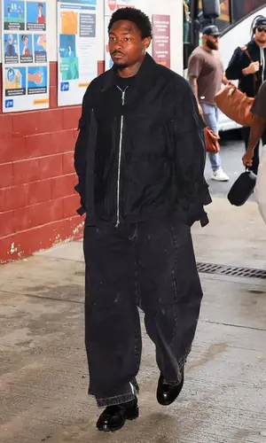 Stefon Diggs’ Outfit in Dries Van Noten Jacket, Maison Margiela Jeans & Alexander McQueen Boots (2023)