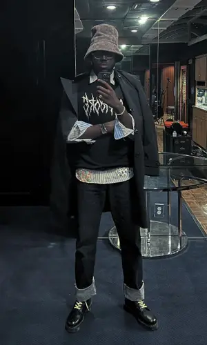 Bnyx wearing Dr. Martens boots