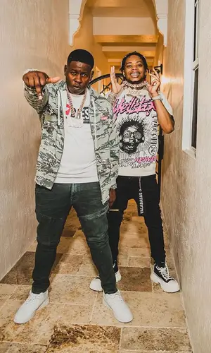 Lil Migo wearing Valabasas jeans
