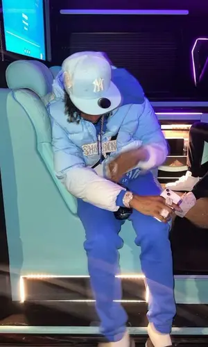 Russ Millions’ Outfit in Trapstar Jacket & Dior Sandals (2023)