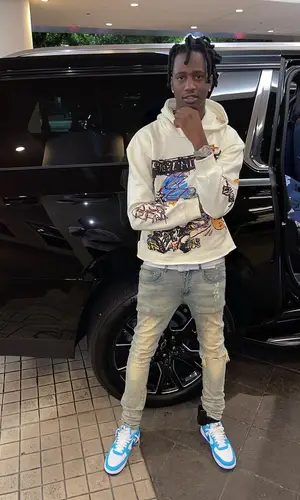 Yung Mal’s Outfit in Ricchezza Forever Hoodie, Tulones Jeans & Louis Vuitton Belt (2023)