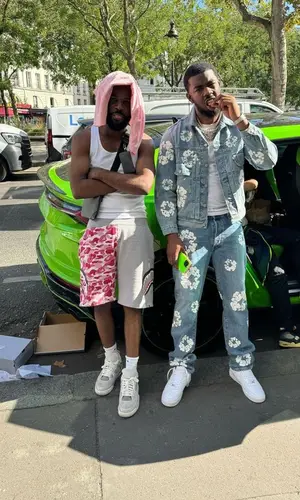 Tion Wayne’s Outfit in Denim Tears Jacket, Nike Sneakers & Levi’s (2023)