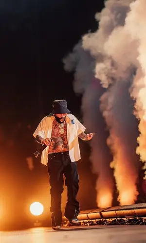 Arcangel’s Outfit in Rhude Shirt, Rick Owens Jeans & Palm Angels Hat (2023)