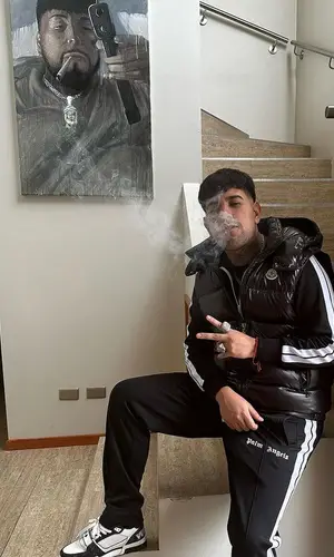Julianno Sosa wearing Palm Angels pants