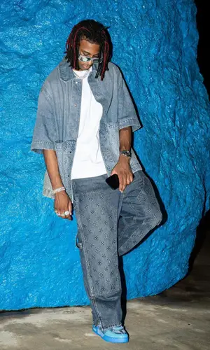 Michael Olise wearing Louis Vuitton sneakers