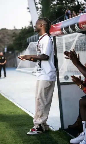 Eduardo Camavinga’s Outfit in Ricchezza Forever T-Shirt, Jordan Pants & Travis Scott Merch Sneakers (2023)