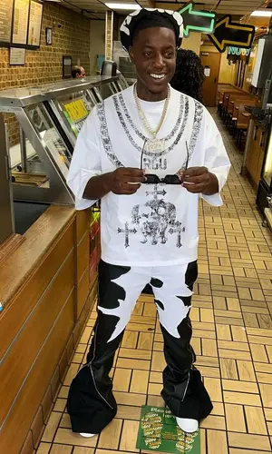 OMB Peezy’s Outfit in Ricco Gioventu T-Shirt, Billionaire Studios Pants & Nike Sneakers (2023)