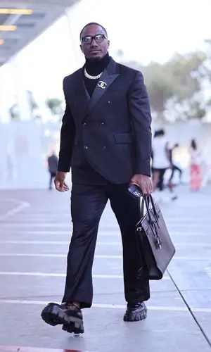 Deebo Samuel’s Outfit in Amiri Jacket, Prada Boots & Saint Laurent Bag (2023)