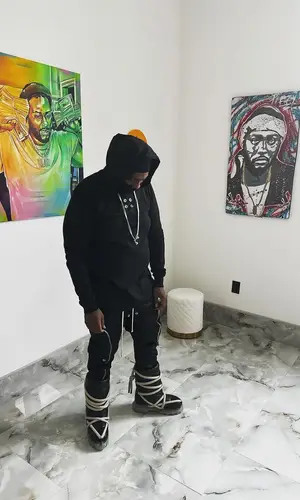 Peezy wearing Rick Owens boots