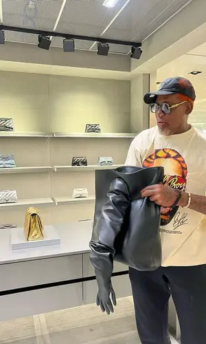Dennis Rodman wearing Balenciaga bag