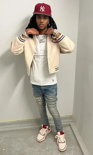 Lil Darius wearing New Era cap