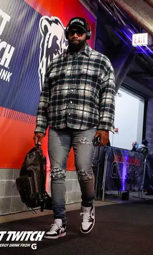 Marcedes Lewis wearing Louis Vuitton backpack