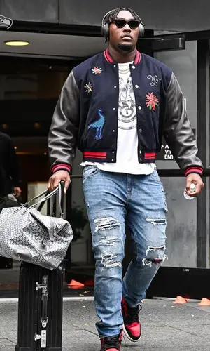 Charles Cross wearing Nike sneakers