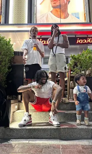 Russ Millions’ Outfit in Hanes T-Shirt, Nike Shorts & Jordan Sneakers (2023)