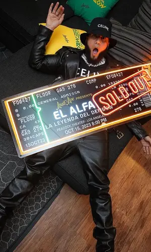 El Alfa El Jefe wearing Celine boots